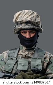 Portrait Of Professional Military Man Dressed In Camouflage Helmet And Uniform.