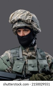 Portrait Of Professional Military Man Dressed In Camouflage Helmet And Uniform.