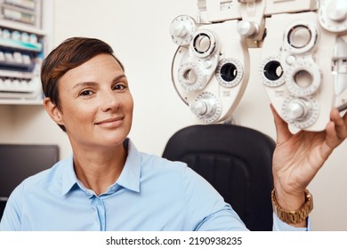 Portrait Of Professional Optometrist, Confident And Happy In An Optometry Office Preparing Equipment For Eye Checks. Caucasian Female Health And Ophthalmology Expert Ready To Test A Patient