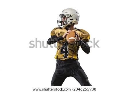 Portrait of professional sportsman, american football player throwing a ball isolated over white grass flooring background. Concept of active life, team game, energy, sport, competition, ad