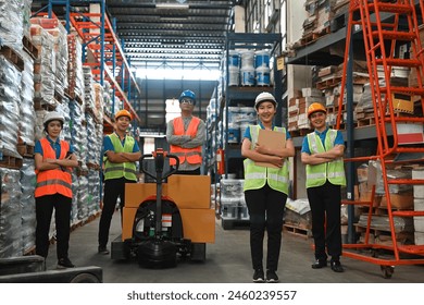 Portrait of a professional team consists of an engineer, foreman, technician, and worker with arms crossed together in warehouse, Unity and teamwork concept. - Powered by Shutterstock