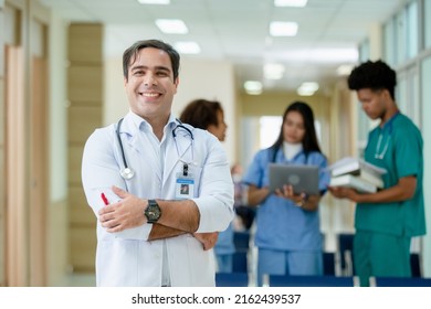 Portrait Of Professor Doctor Hanging Stethoscope Have A Group Students On Background In Classroom Hospital Medical School.