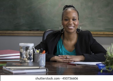Portrait of a proud, black female teacher