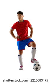 Portrait Of Proud Young Man, Football Player In Uniform Posing With Ball Isolated Over White Studio Background. Defender. Concept Of Sport, Team Game, Action, Motion. Copy Space For Ad, Poster