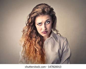 Portrait Of Puzzled Woman