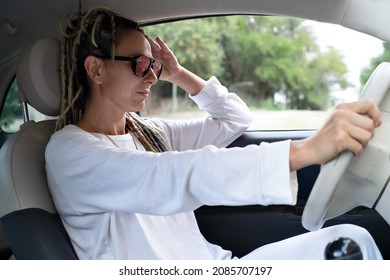 Portrait Of Rasta Woman With Googles Driving A Car