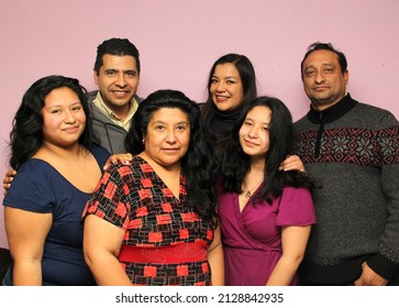 Portrait Of A Real Mexican Latino Family With Diverse Bodies With Father, Mother, Sons And Brothers Very Happy Posing To The Camera
