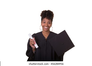 Portrait Of A Recent College Graduate In Gown Holding Her Diploma Isolated On White