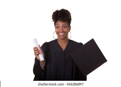 Portrait Of A Recent College Graduate In Gown Holding Her Diploma Isolated On White