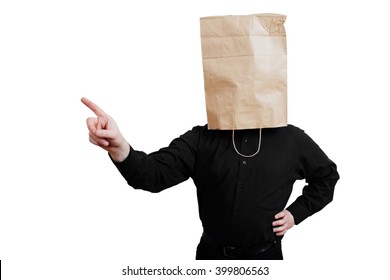 Portrait of a red-bearded, balding male brutal. White isolated background. Black shirt and pants. Paper bag over head, wag threatens finger