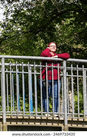 Similar – happy twin sisters stand on a bridge and look up