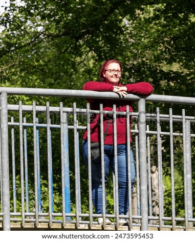 Similar – happy twin sisters stand on a bridge and look up