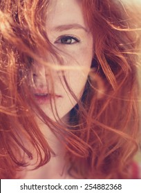 Portrait of red-haired girl close-up