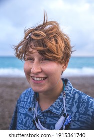 Portrait Of A Red-haired Girl With Freckles, A Woman With Short Hair, Wind In Her Hair, A Walk Along The Coast, Smiling Girl On The Beach.