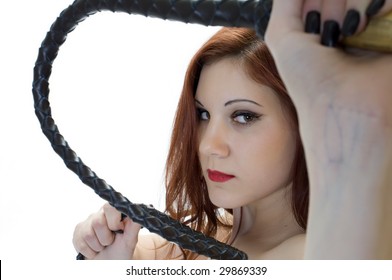 Portrait Of Red-Headed Dominatrix With Bull Whip.