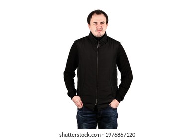 Portrait Of Regular Average Male Dressed In Black Clothing. Man Holds His Hands In Pockets. Isolated, White Background.
