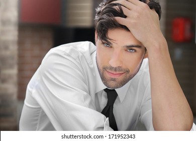 Portrait Of A Relaxed Young Man With Playful Sexy Smirk