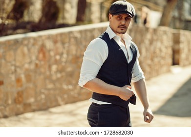 Portrait of retro 1920s english arabian business man wearing waistcoat.