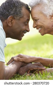 Portrait Of Romantic Senior African American Couple In Park