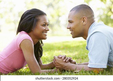 Portrait Of Romantic Young African American Couple In Park