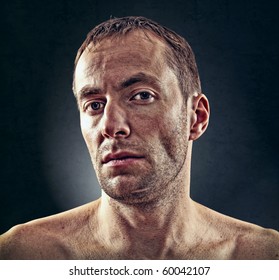 Portrait Of Rough Face  Man Over Dark Background