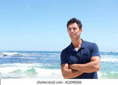 Portrait Of Rugged Middle Aged Man Standing At The Beach