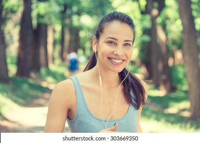 Portrait Running Young Woman. Female Runner Jogging During Outdoor Workout In Park On Spring Summer Day. Beautiful Fit Girl. Attractive Fitness Model Outdoors. Weight Loss Healthy Lifestyle Concept 