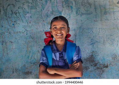 portrait of a rural school girl Smiling and standing in School
