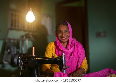 PORTRAIT OF A RURAL WOMAN SEWING CLOTHES
 - Shutterstock ID 1965100597