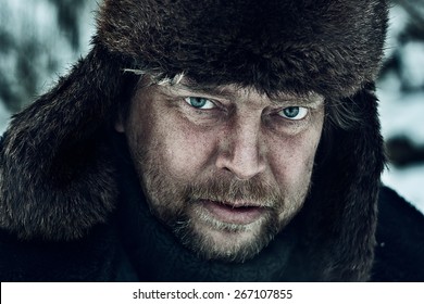 Portrait Of A Russian Man In Winter Hat