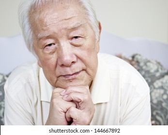 Portrait Of A Sad Asian Senior Man.