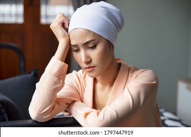 Portrait Of Sad Asian Woman Cancer Patient Wearing Head Scarf After Suffering Serious Hair Loss Due To Chemotherapy