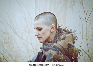 Portrait Of Sad Beautiful Caucasian White Young Bald Girl Woman With Shaved Hair Head In Leather Jacket And Scarf Shawl Looking Away, Toned With Instagram Filters In Blue Green Color