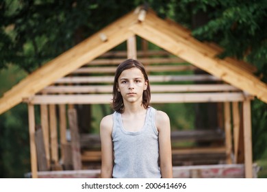 Portrait Of A Sad Boy Outside In Nature