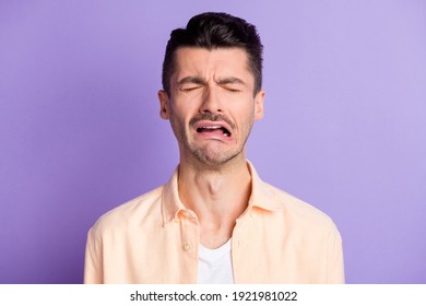 Portrait Of Sad Crying Brunet Hair Guy Wear Peach Shirt Isolated On Lilac Color Background