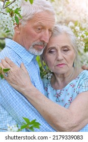 Portrait Of Sad Elderly Couple At Park