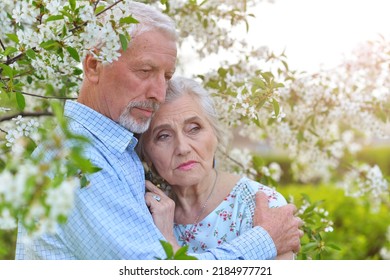 Portrait Of Sad Elderly Couple At Park