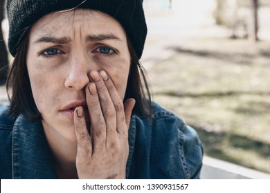 Portrait Of Sad Homeless Woman Outdoors