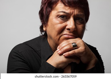 Portrait of sad lonely pensive middle aged woman.