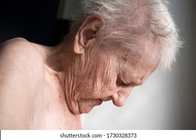 portrait of sad lonely pensive old senior woman looking down - Shutterstock ID 1730328373