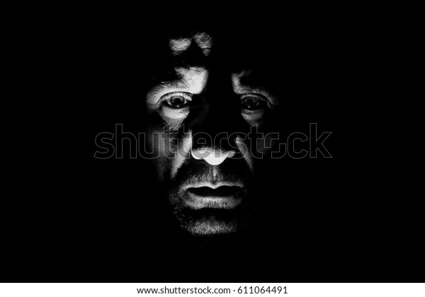 Portrait of sad man with\
chiaroscuro, craggy and marked face, wild man alone in the dark\
with high contrast, dark side of human, fugitive from justice,\
devil and gangster