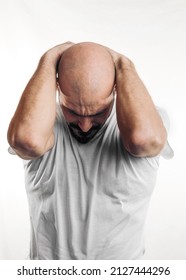 Portrait Of A Sad Man With A Hand On His Head On White Background. Bald 40 Year Old 