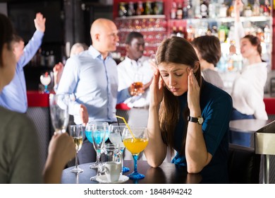 Portrait Of Sad Woman Bored At Corporate Party