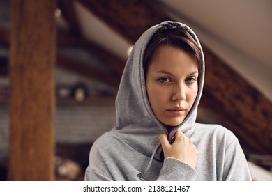 Portrait of sad woman struggling with her mental health issues and looking at camera. - Shutterstock ID 2138121467