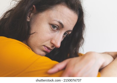 Portrait Of A Sad Woman In A Yellow Dress, Pensive Brunette, Sad Mood, Melancholy, Girl In A White Room