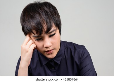 Portrait of sad young transgender person