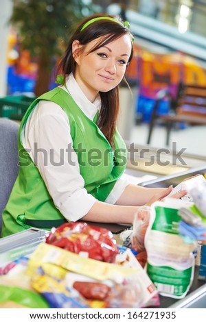 Portrait of Sales assistant or cashdesk worker in supermarket store