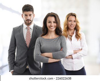 Portrait Of Sales Team Standing At Office. 