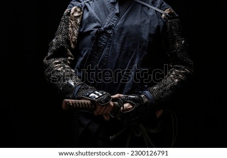 Portrait of the samurai who wearing gauntlet.