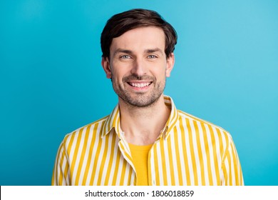 Portrait Of Satisfied Attractive Man Look Good Mood In Camera Toothy Smiling Wear Striped Yellow Shirt Isolated Over Blue Color Background